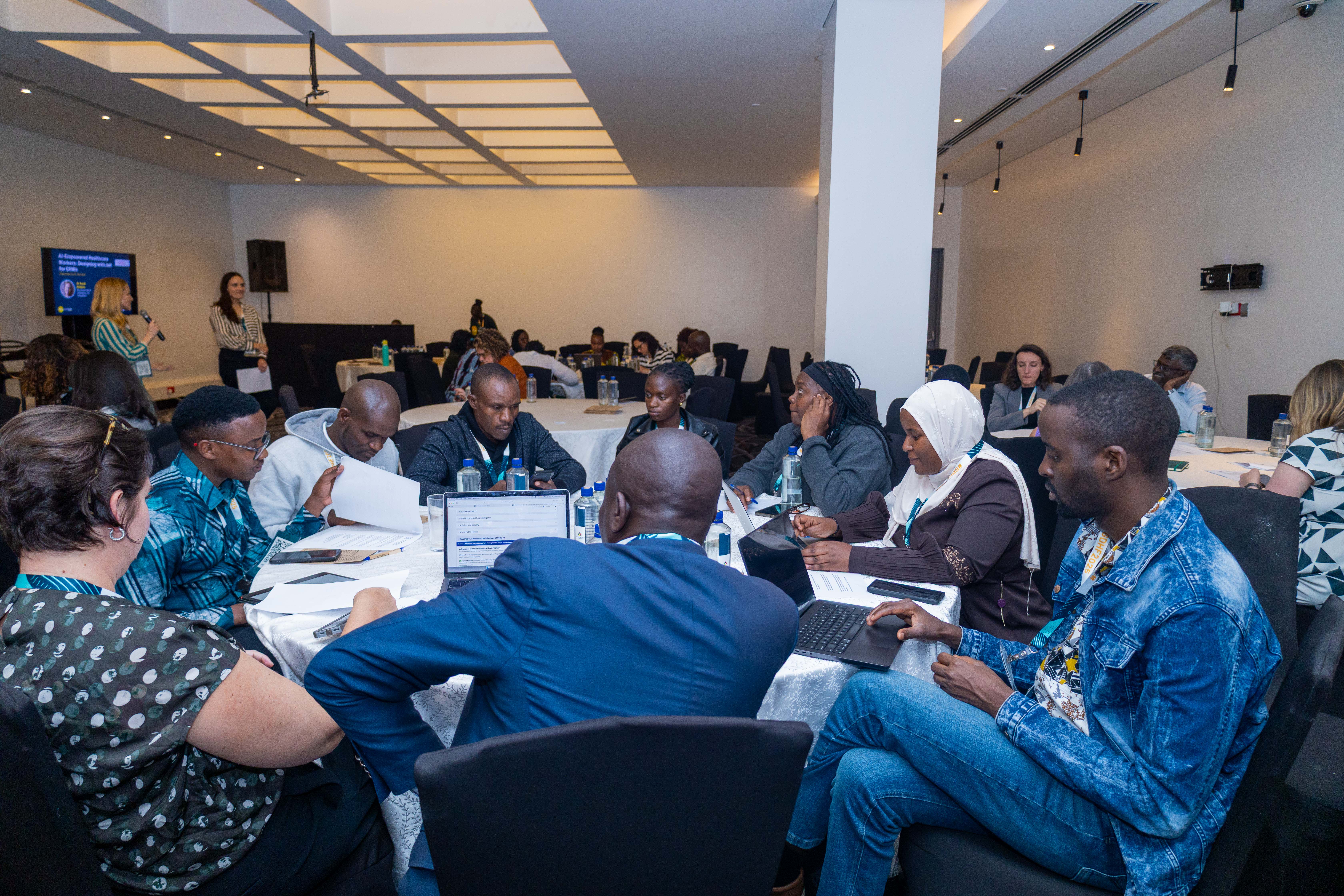 A workshop session with community health workers and partners reviewing course content together